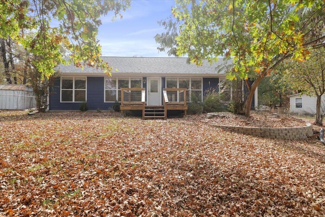 back of house with a sunroom