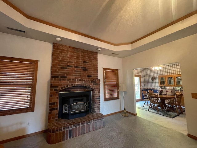 living room featuring a textured ceiling and a wood stove