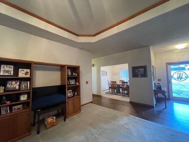 living room with ornamental molding, a healthy amount of sunlight, and dark hardwood / wood-style flooring