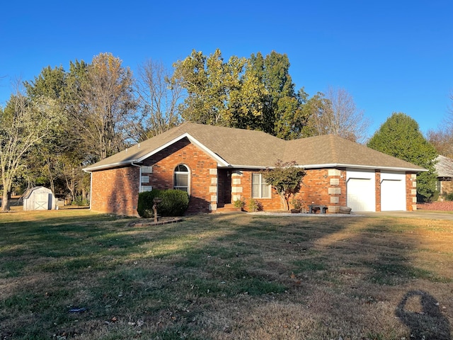 ranch-style home featuring a storage unit, a front lawn, and a garage