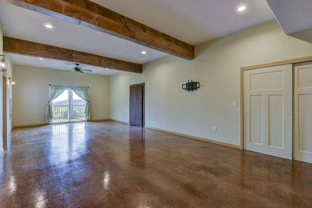 spare room featuring beamed ceiling, concrete floors, and ceiling fan