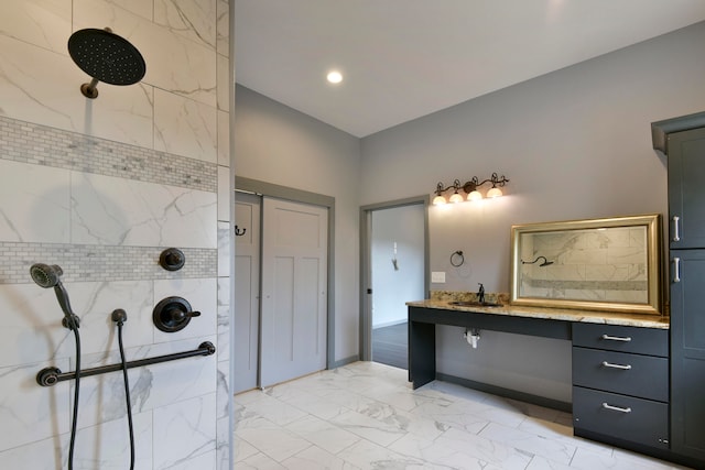 bathroom featuring vanity and a tile shower