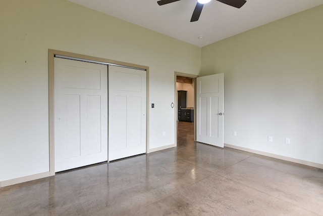3133 Talking Rocks Rd, Reeds Spring, MO 65737 - unfurnished bedroom with finished concrete flooring, baseboards, a closet, and ceiling fan