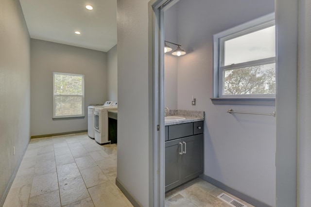 3133 Talking Rocks Rd, Reeds Spring, MO 65737 - bathroom with washing machine and dryer, vanity, baseboards, and recessed lighting