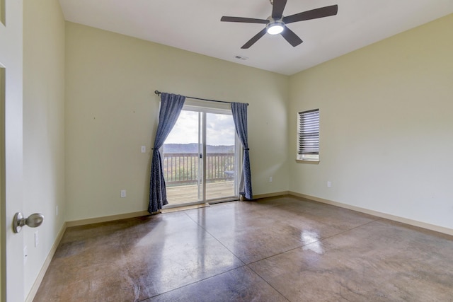 3133 Talking Rocks Rd, Reeds Spring, MO 65737 - unfurnished room with finished concrete floors, baseboards, and a ceiling fan