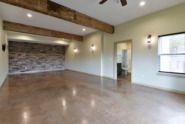 unfurnished room with beamed ceiling, concrete flooring, and ceiling fan