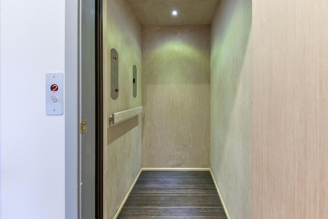 3133 Talking Rocks Rd, Reeds Spring, MO 65737 - corridor featuring elevator, dark wood-style flooring, and baseboards