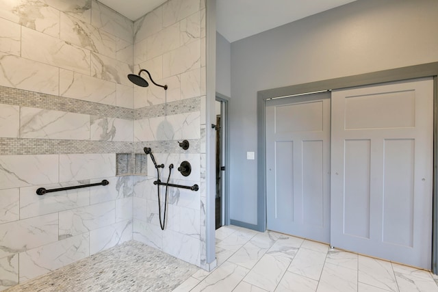 bathroom with tiled shower