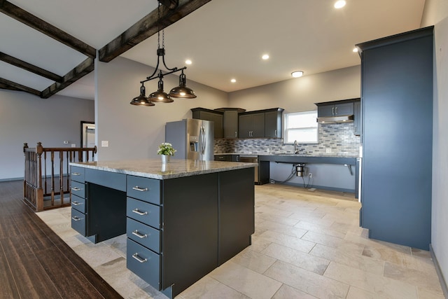 kitchen featuring a kitchen island, backsplash, hanging light fixtures, beam ceiling, and stainless steel refrigerator with ice dispenser