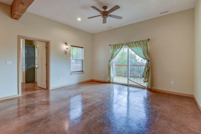 unfurnished room featuring beamed ceiling, concrete flooring, and ceiling fan