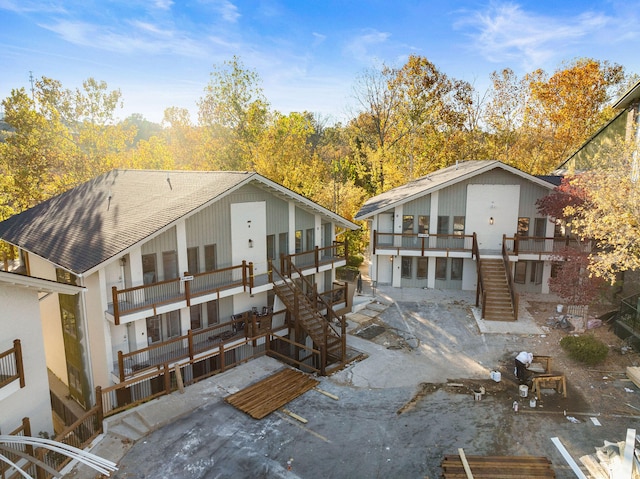 back of house featuring a balcony