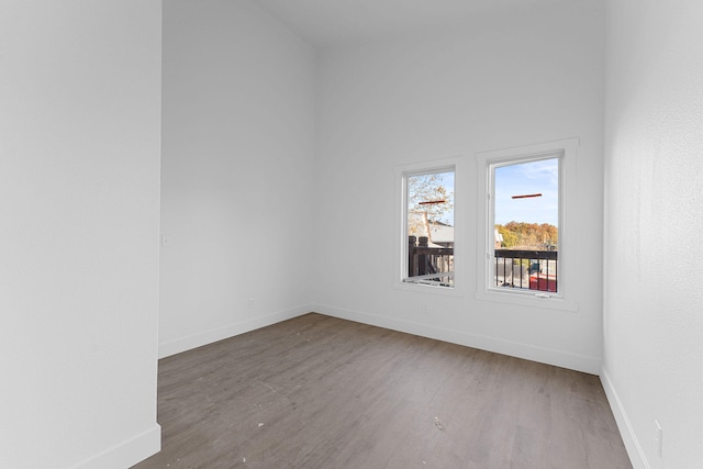 empty room with wood-type flooring