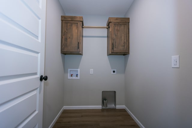 laundry area with hookup for a washing machine, electric dryer hookup, cabinets, and dark hardwood / wood-style flooring