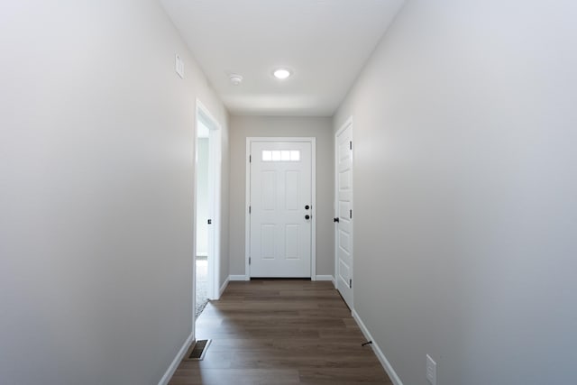 entryway with dark hardwood / wood-style floors