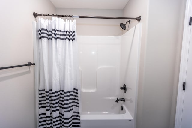 bathroom with shower / bath combination with curtain