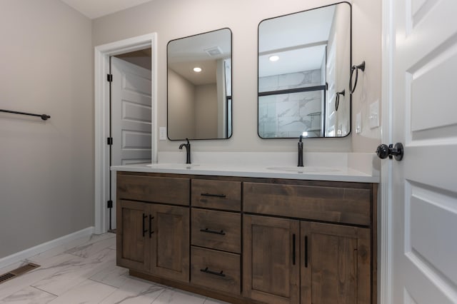 bathroom featuring vanity and a shower