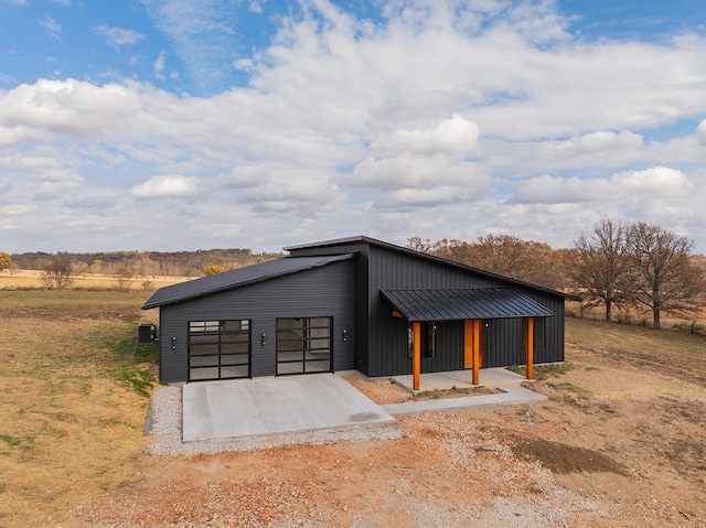 view of front of home with a rural view