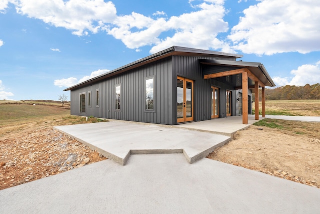 view of side of home featuring a patio