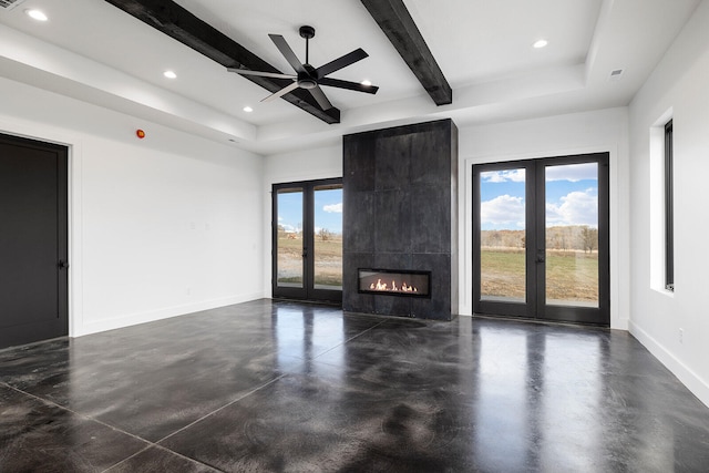 unfurnished living room featuring french doors, a fireplace, beamed ceiling, and ceiling fan