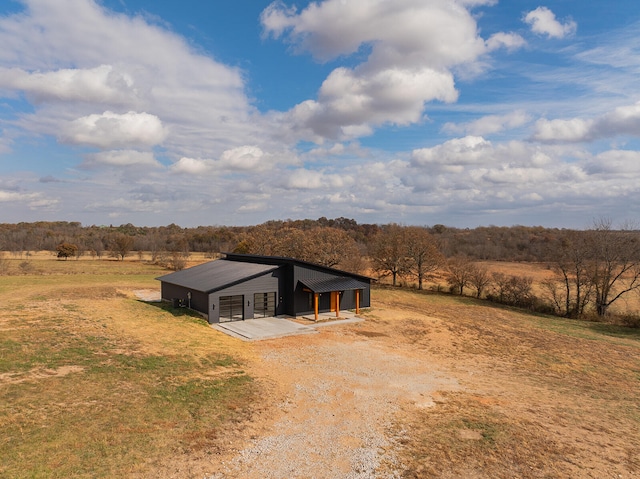 view of front facade with a rural view