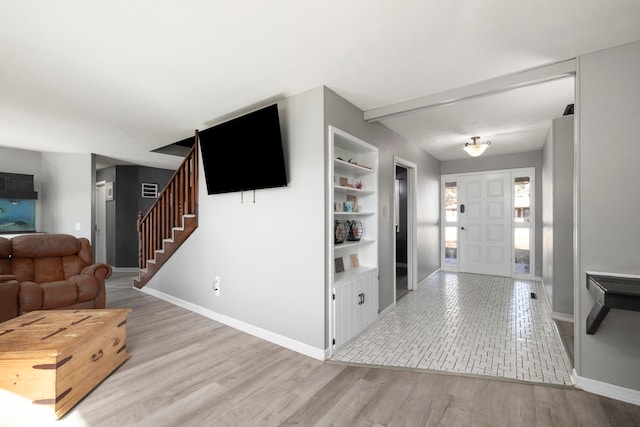 foyer entrance with light hardwood / wood-style flooring