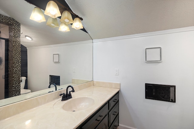 bathroom featuring vanity, ornamental molding, and toilet