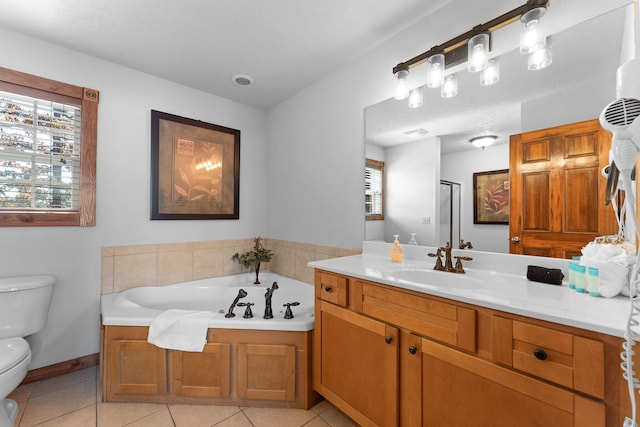 full bathroom with toilet, a healthy amount of sunlight, vanity, and tile patterned flooring