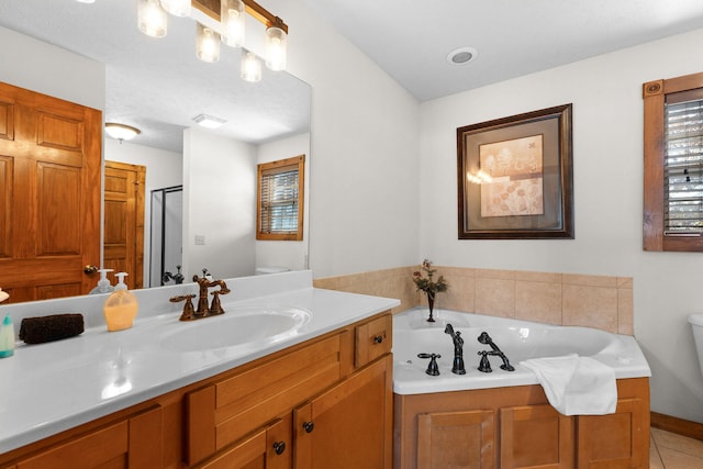 bathroom featuring vanity, shower with separate bathtub, a textured ceiling, and tile patterned floors