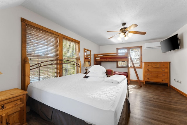 bedroom with lofted ceiling, an AC wall unit, dark hardwood / wood-style flooring, a textured ceiling, and ceiling fan