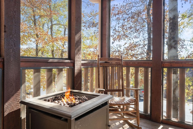 sunroom / solarium featuring a healthy amount of sunlight