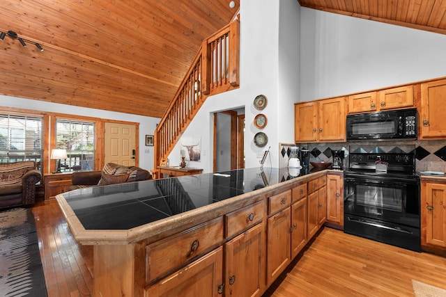 24 Baldknobber Dr Unit 18, Branson West, MO 65737 - kitchen featuring black appliances, wooden ceiling, tasteful backsplash, a peninsula, and light wood-type flooring