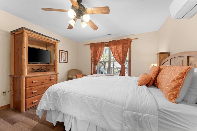 24 Baldknobber Dr Unit 18, Branson West, MO 65737 - bedroom with an AC wall unit, wood finished floors, and a ceiling fan
