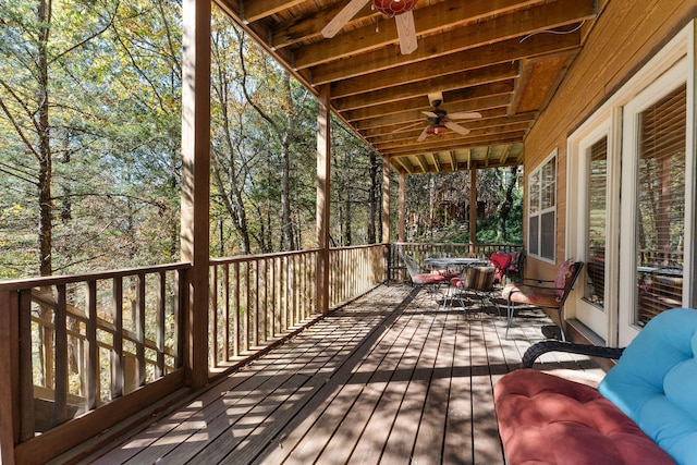 wooden deck featuring ceiling fan