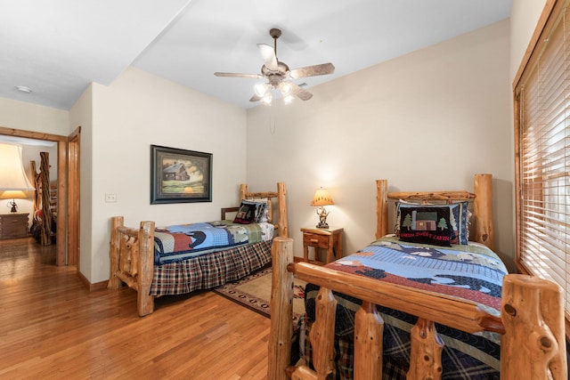 bedroom featuring hardwood / wood-style floors and ceiling fan