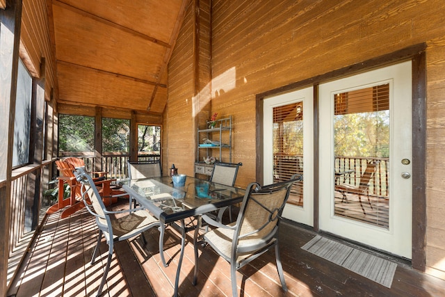 sunroom / solarium featuring a wealth of natural light, lofted ceiling, and wood ceiling