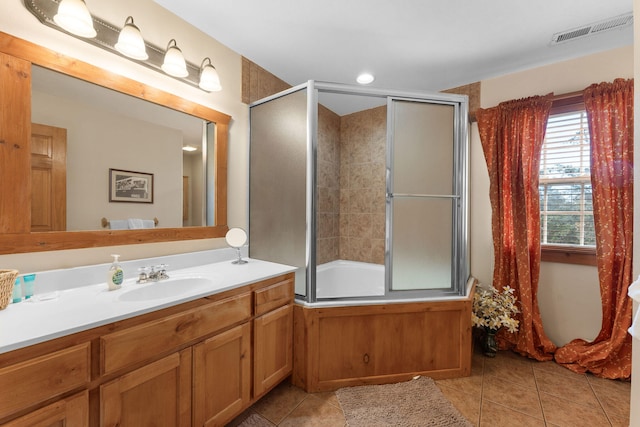 bathroom with vanity, bath / shower combo with glass door, and tile patterned flooring