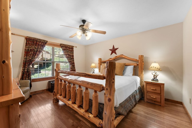 bedroom featuring ceiling fan and hardwood / wood-style flooring