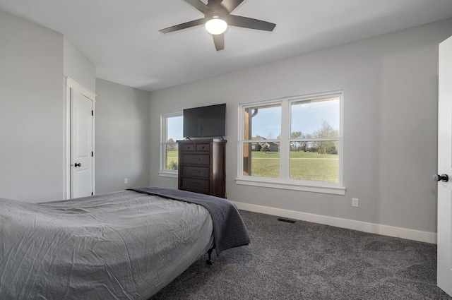 bedroom featuring ceiling fan and carpet