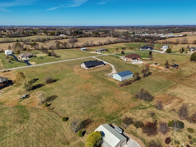 birds eye view of property featuring a rural view