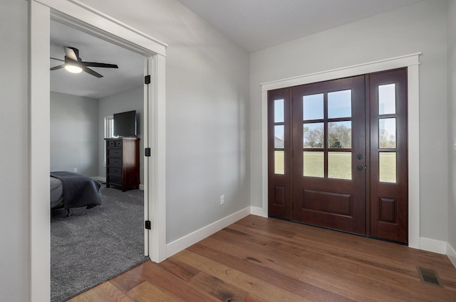 foyer entrance featuring hardwood / wood-style floors and ceiling fan