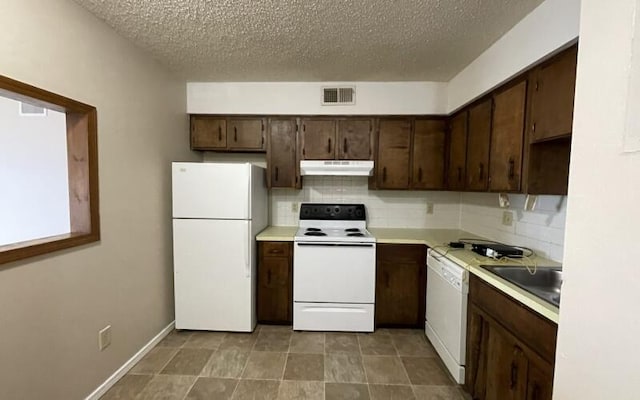 933 S Wildan Ave, Springfield, MO 65802 - kitchen featuring white appliances, a sink, under cabinet range hood, tasteful backsplash, and light countertops