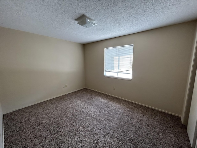 933 S Wildan Ave, Springfield, MO 65802 - carpeted spare room with baseboards and a textured ceiling