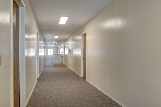 corridor featuring light carpet