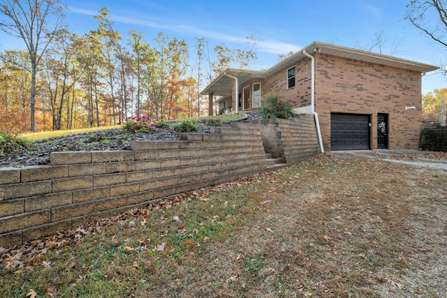 view of side of home with a garage