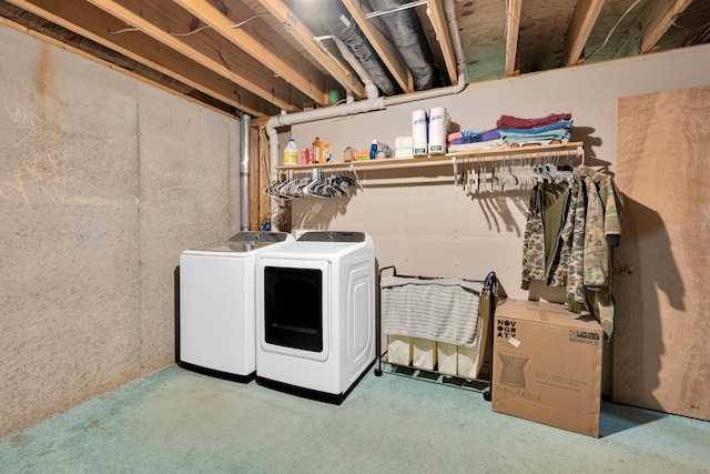 laundry room featuring washer and clothes dryer and carpet floors