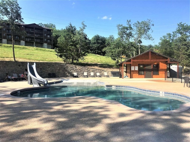 70 Dogwood Park Trl Unit 1510, Branson, MO 65616 - view of pool featuring a patio, a water slide, and an outdoor structure