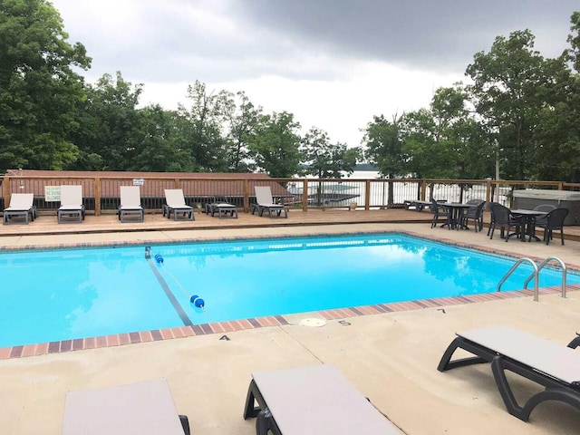 view of swimming pool featuring a patio area