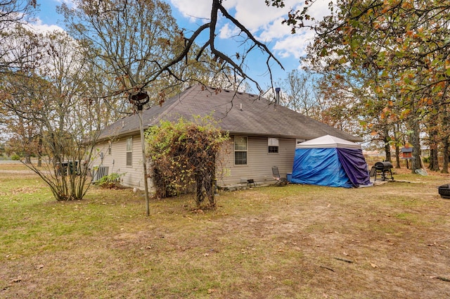 rear view of house with a lawn