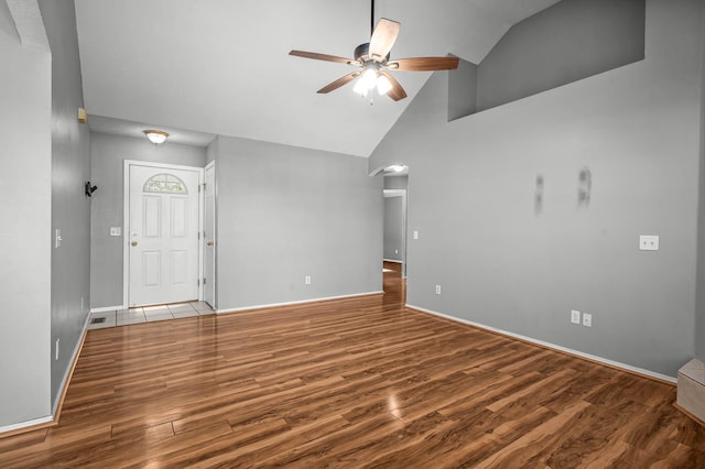 unfurnished living room with hardwood / wood-style flooring, high vaulted ceiling, and ceiling fan