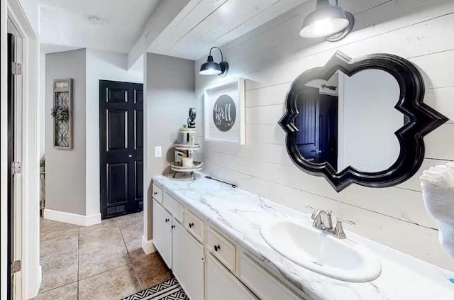 bathroom with vanity and tile patterned floors